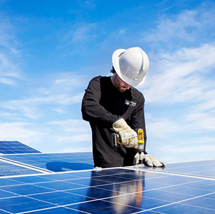 Worker installing solar panels on a rooftop, emphasizing innovation and sustainability in solar technology.