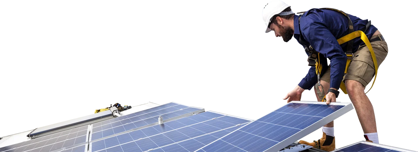 Worker installing solar panels on a rooftop, emphasizing solar energy solutions and installation services.