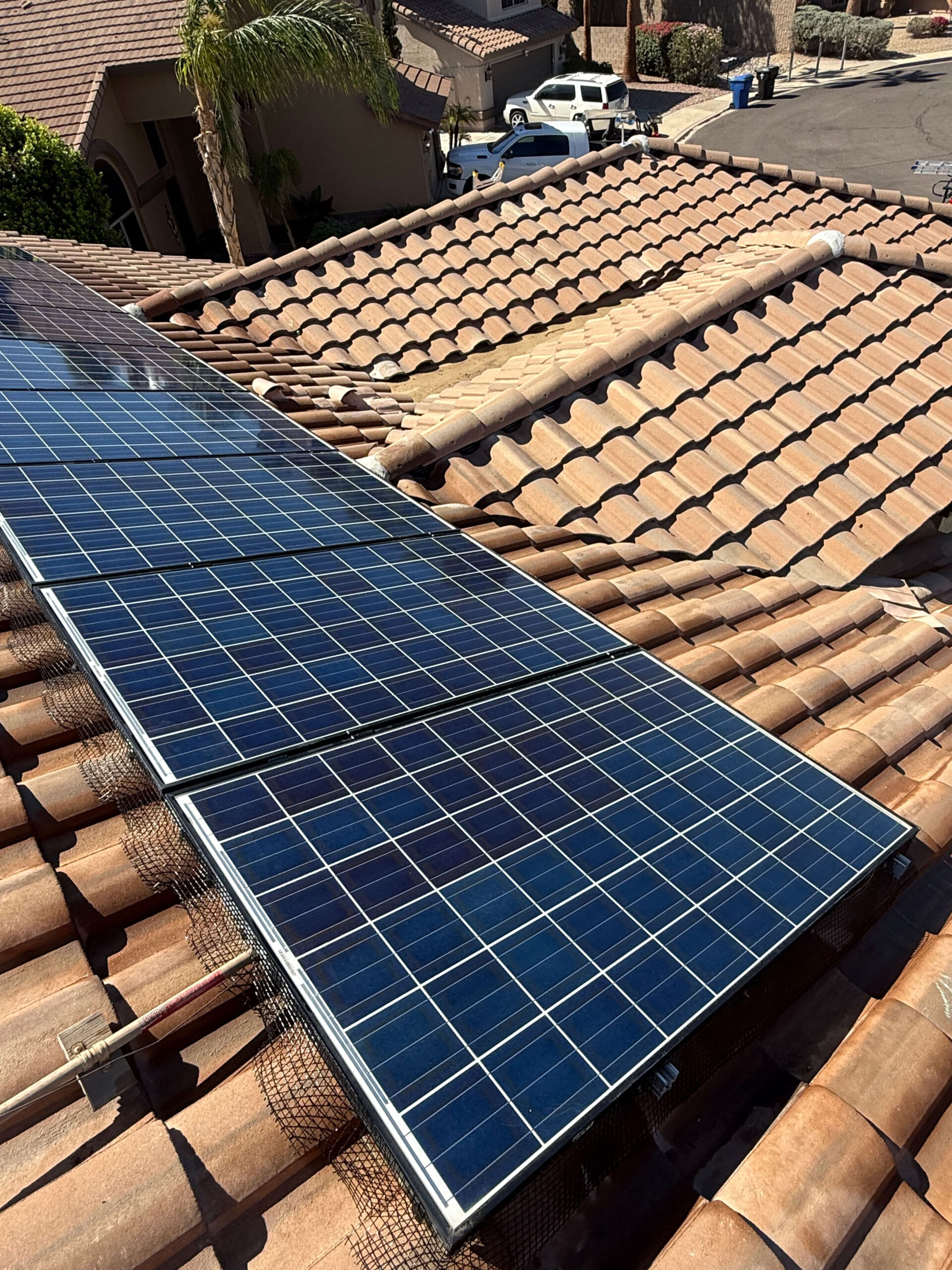Solar panels installed on a tiled roof, showcasing the integration of solar technology in roofing projects, emphasizing Solar Detach & Reset's expertise in safe solar removal and reinstallation.