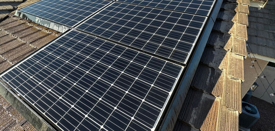 Solar panels installed on a rooftop, showcasing energy-efficient solar technology for residential use.