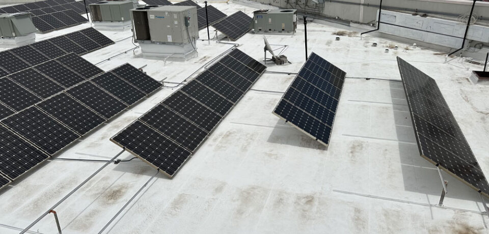 Solar panels installed on a rooftop, showcasing energy-efficient solar technology for cooling and power generation.